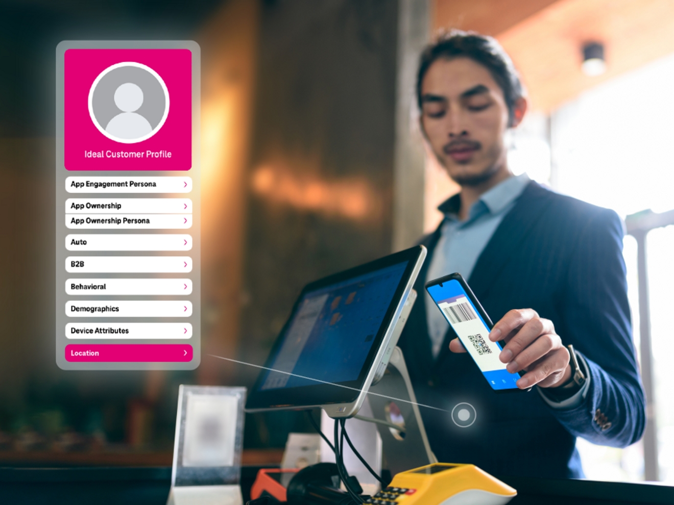 Customer holds his phone in front of a scanner at a business. T-Mobile Mobility Data Screen recognizes customer’s location.
