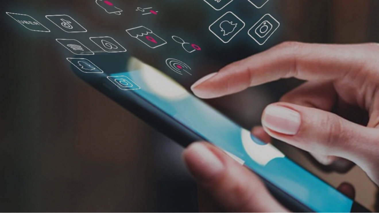 Person choosing from a wide variety of apps by tapping phone screen.