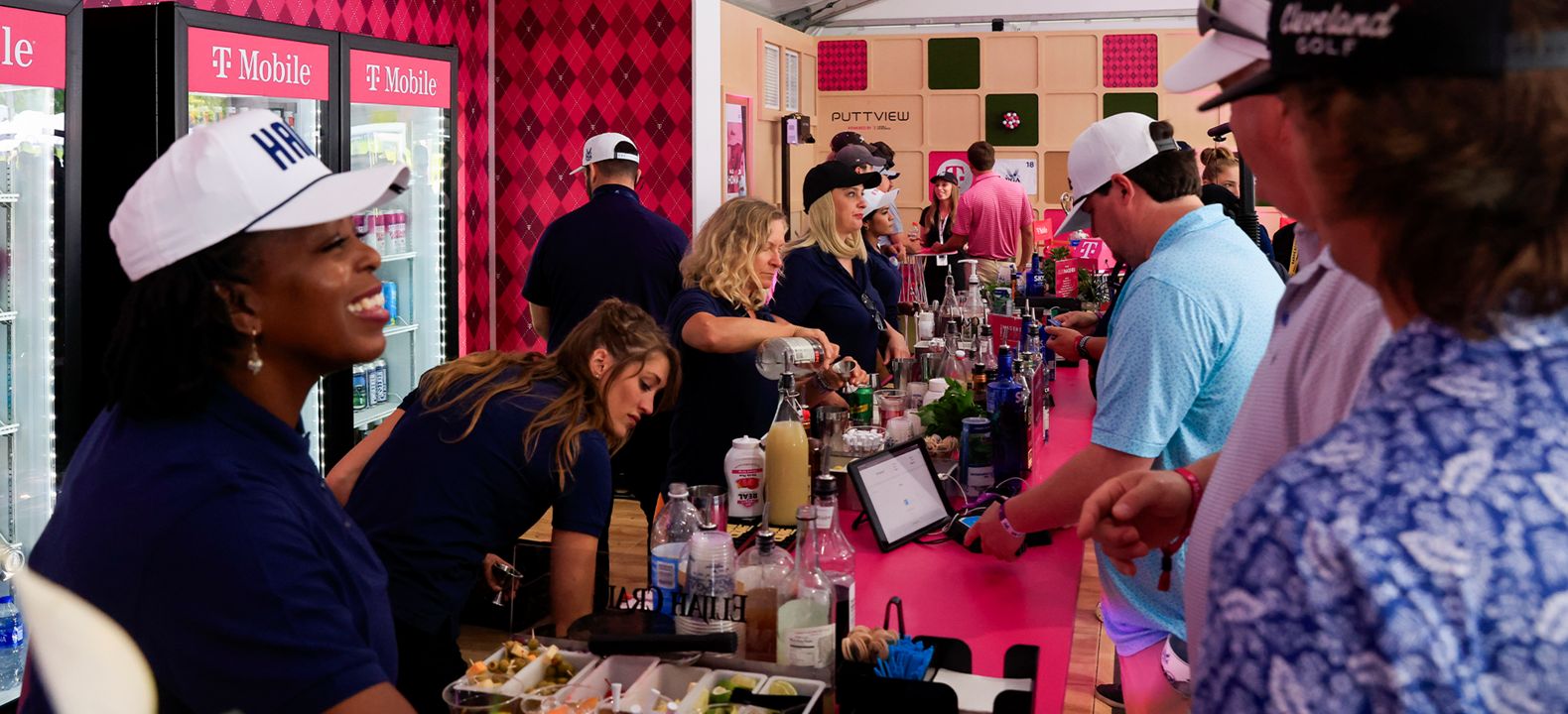 T-Mobile members ordering drinks at a sponsored event.