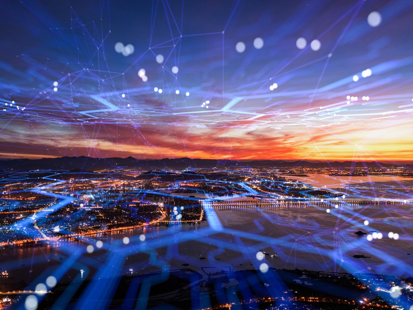 Vista aérea con la red celular cubriendo toda la ciudad.