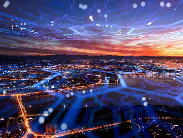 Vista aérea con la red celular cubriendo toda la ciudad.