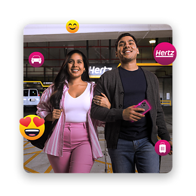 Una pareja joven, rodeada de emoticones felices, camina en un estacionamiento de Hertz.