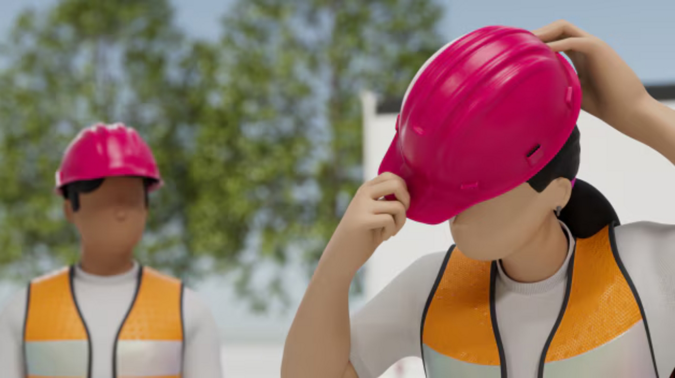 Dos trabajadores de la construcción con cascos de seguridad magenta.