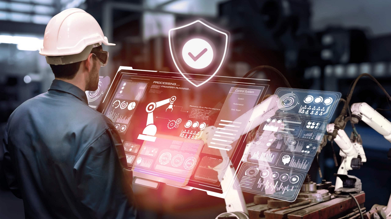Un director de operaciones de una planta de fabricación supervisa de forma segura el rendimiento de equipos robotizados.