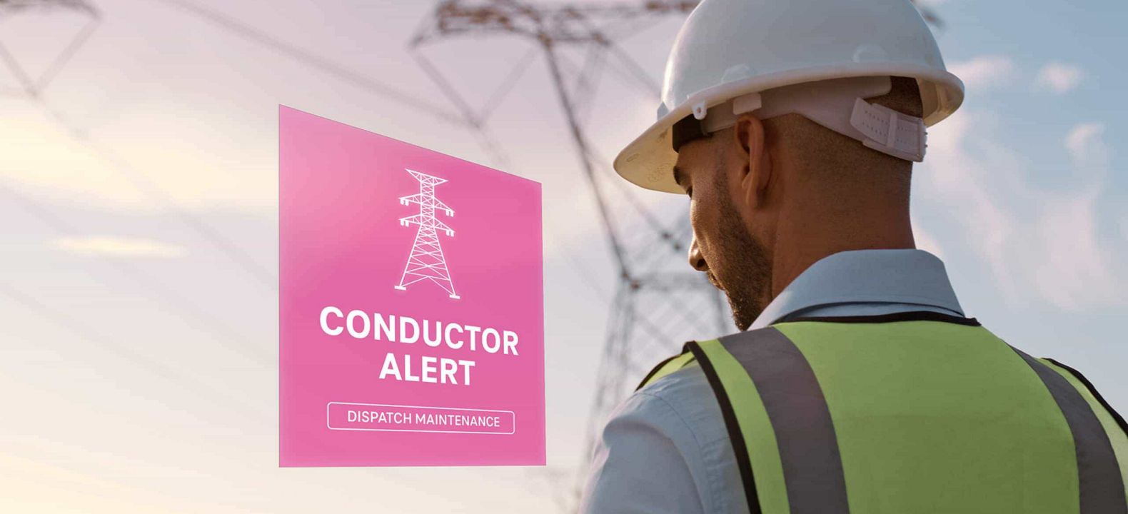 Trabajando con su tablet en el exterior, un ingeniero eléctrico ve una alerta sobre un conductor de energía.