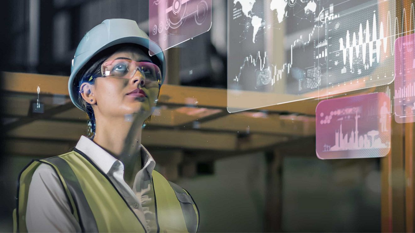 Un profesional de gestión logística utiliza gafas de realidad aumentada para revisar datos de transporte.