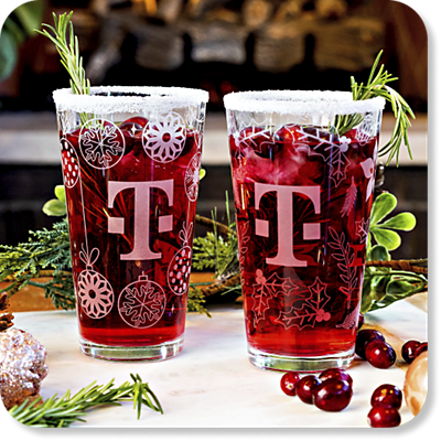 Seasonal T-Mobile holiday glassware filled with a festive drink.